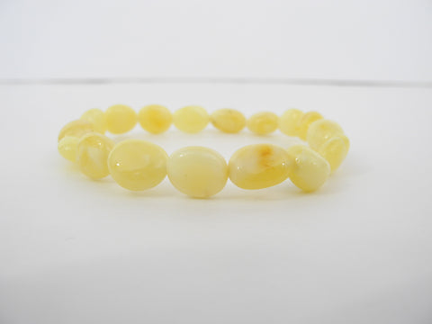 GENUINE BALTIC AMBER STRETCH BRACELET OVAL, BUTTER-WHITE  6.75 gm  7 " ALLUREGEM  S1212